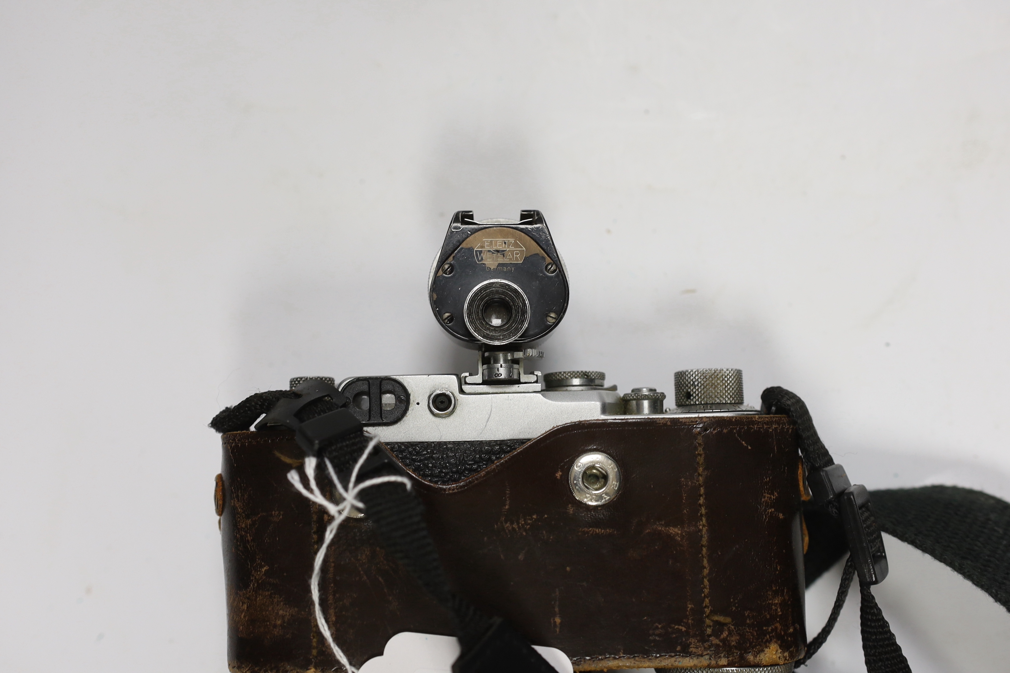 A Leica IIf camera, serial no. 577837, c. 1952-3, with Leitz Vidom viewfinder, Summar f+5cm 1.2 lens, in leather case with replacement strap